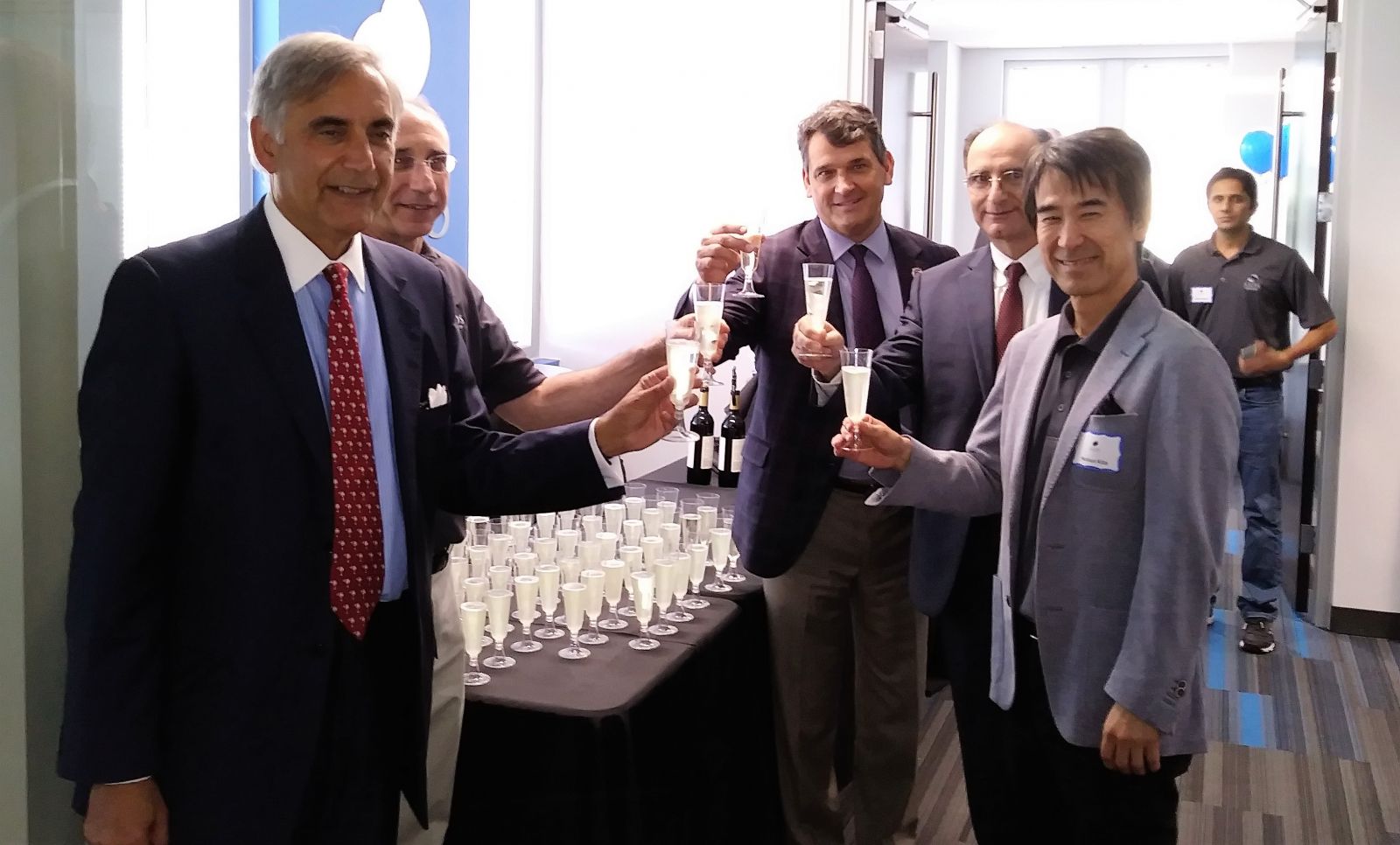 From left: University of South Carolina President Harris Pastides, Jerry Melnick, president and CEO of SIOS Technology, Bill Kirkland, executive director of USC's Office of Economic Engagement, Hossein Haj-Hariri, dean of the College of Engineering and Computing and Nobuo Kita, chairman of Board of Directors for SIOS Technology, share a glass of champagne at the ribbon cutting of SIOS Techonlogy's new research and development center on the campus of USC.