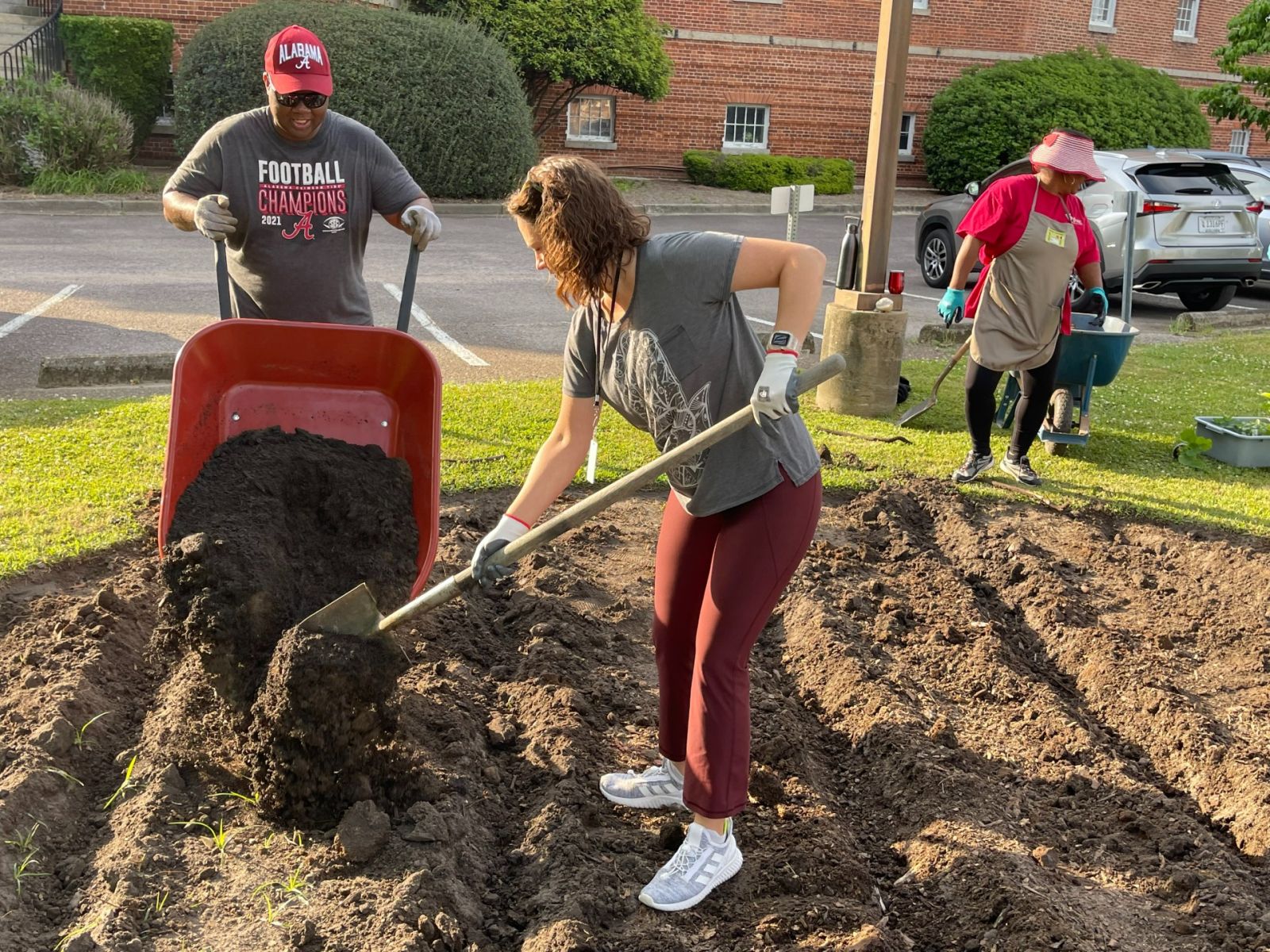 DHEC employees plant the first seeds in the agency's Community Demonstration Garden on the lawn of 2100 Bull St. (Photo/Provided)