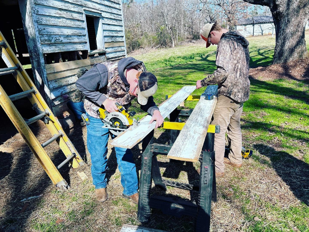 Students from the S.C. Governor's School for Agriculture at John de La Howe work to repair a barn. (Photo/Provided)