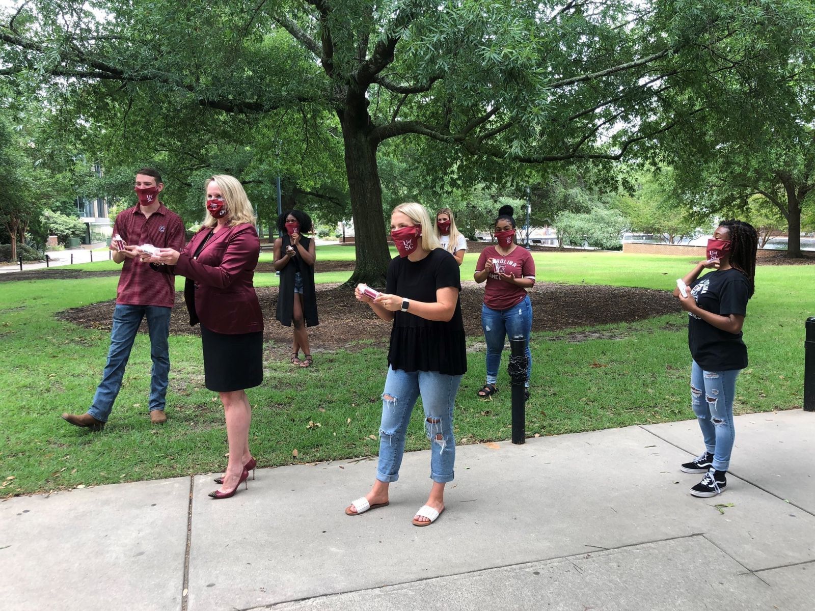 Nephron CEO Lou Kennedy hands out company-made hand sanitizer at the University of South Carolina, her alma mater. (Photo/Provided)