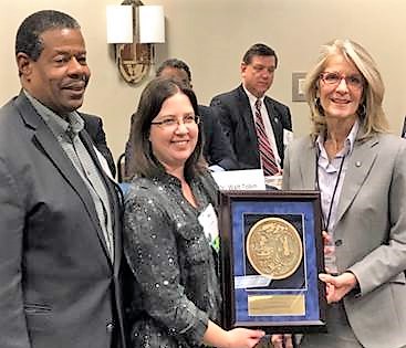 MTC president Ron Rhames (left) and MTC provost Barrie Kirk (right) accept the S.C. Technical College System award for team innovation from S.C. Technical Education Association president Latesha McComas. (Photo/Provided)