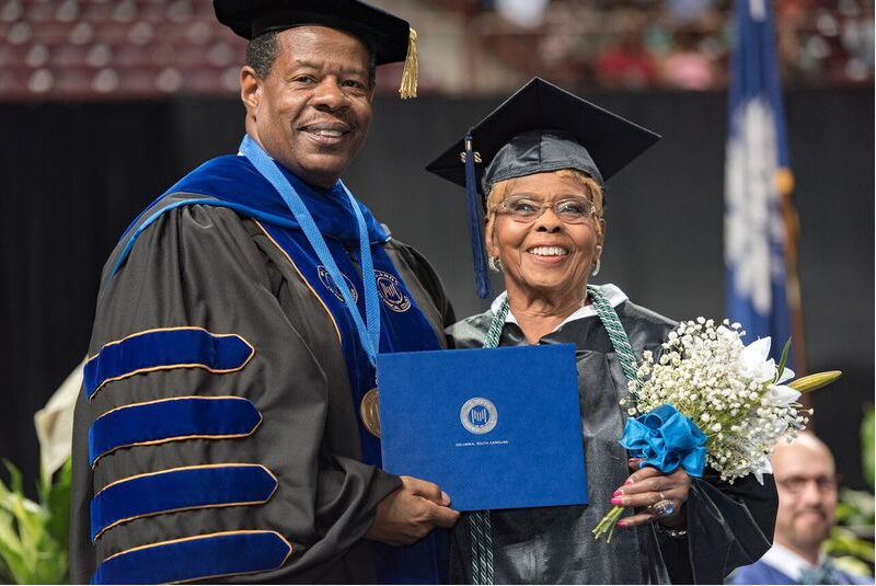 Annie Dillard, 92, pictured with Midlands Tech president Ronald Rhames, received an Associate of Arts degree at age 92. (Photo/Provided)