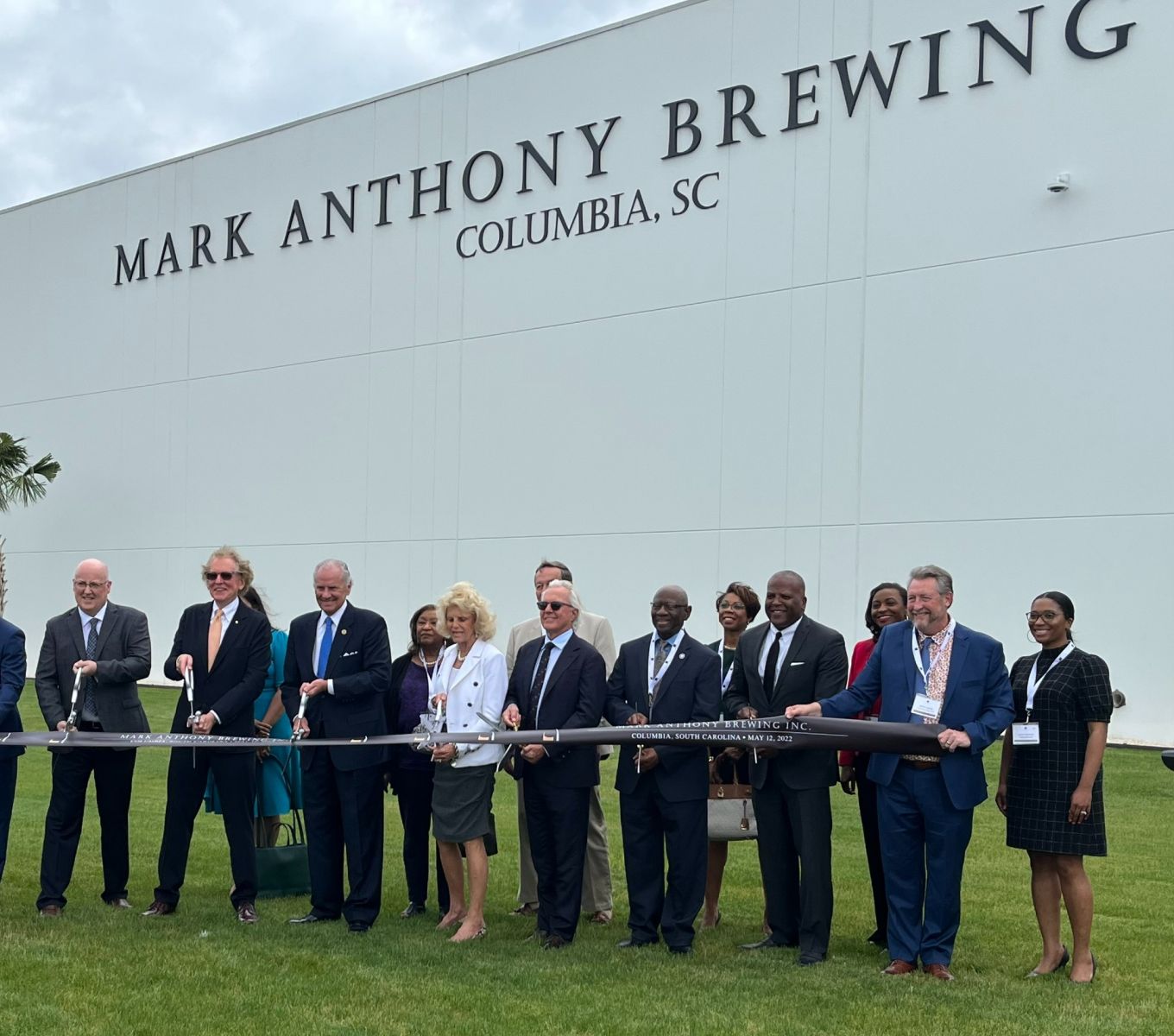 Mark Anthony Brewing celebrated the official grand opening of its  $400 million, 1.3 million-square-foot production facility on Shop Road on Thursday. Founder and CEO Anthony von Mandl (second from left) joined state and county officials in a ribbon cutting. (Photo/Melinda Waldrop)