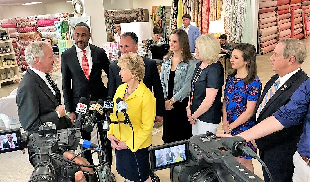 Linda McMahon, U.S. Small Business Adminstration administrator (in yellow), speaks with S.C. Gov. Henry McMaster during a tour of Forest Lake Fabrics, winner of the SBA's 2018 Phoenix Award. Forest Lake Fabrics owner Michael Marsha is standing behind McMahon. (Photo/SBA) 