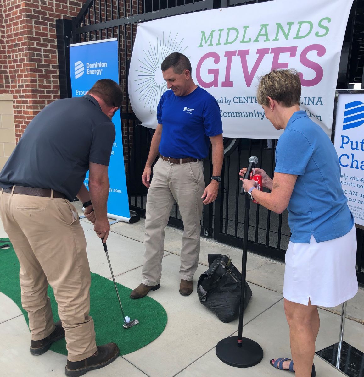 Participants test their skills in the Dominion Energy putting challenge during the 2019 Midlands Gives event at Segra Park. (Photo/Provided)