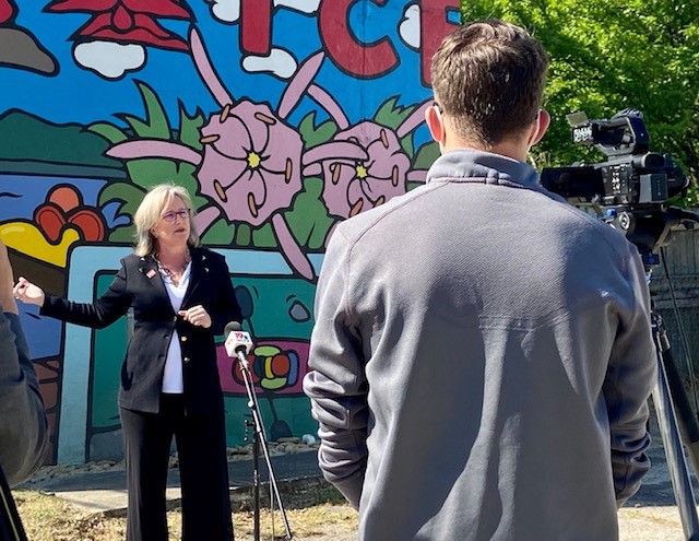 Cayce Mayor Elise Partin speaks in front of a mural in the city's River Arts District. (Photo/MPA Strategies)