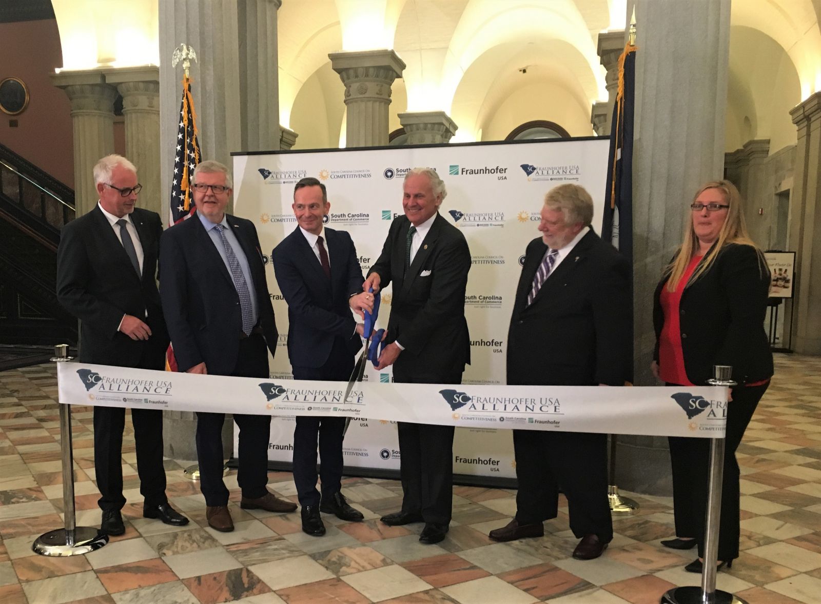 Gov. Henry McMaster cuts a ceremonial ribbon at the announcement of the S.C. Fraunhofer USA Alliance. (Photo/Renee Sexton)