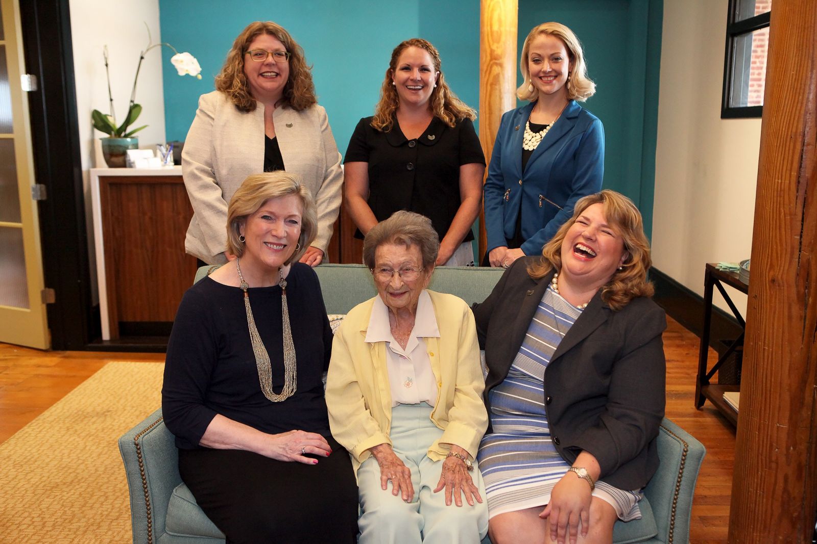 Sarah Leverette (seated, center) visits the Vista law firm of Burnette Shutt & McDaniel P.A. Also pictured are Malissa Burnette (seated, left), Nekki Shutt (seated, right), Kathleen McDaniel (standing, from left), Janet Rhodes and Jacqueline "Jax" Pavlicek. (Photo/Courtesy of Molly Harrell Photography)