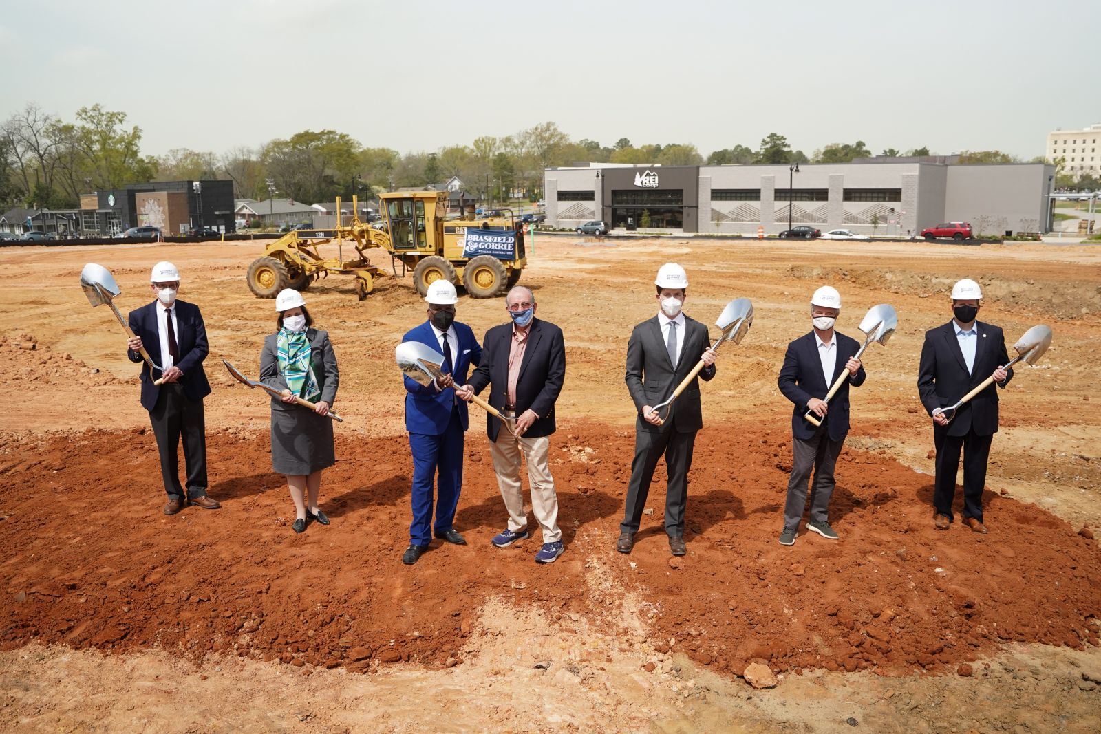 Columbia officials, including Mayor Steve Benjamin (in blue suit) and developers including Robert Hughes, president of Hughes Development Corp. (third from right) break ground Thursday on the WestLawn building. (Photo/Sean Rayford)