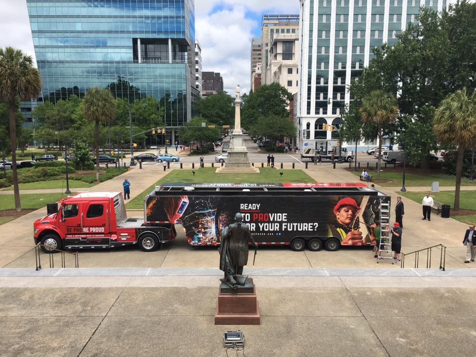 A program that would attempt to drum up interest in careers such as plumbing and electrical work by sending a truck with interactive demonstrations of those careers to various locations throughout S.C. is awaiting state funding. The 18-wheel tractor-trailer first began rolling in Arkansas in 2016 and made an appearance at the S.C. Statehouse last April. (Photo/Carolinas AGC)