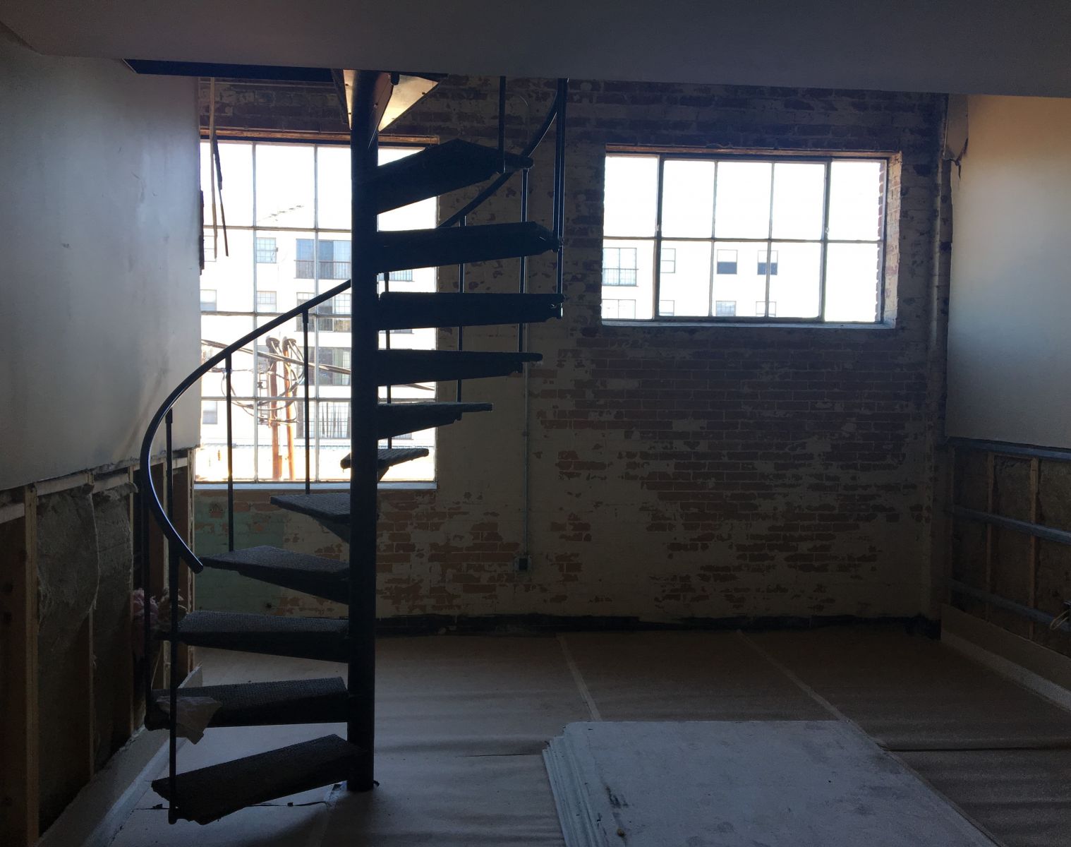 Eight upstairs lofts feature spiral staircases leading to a bedroom. All units are being outfitted with kitchenettes. (Photo/Melinda Waldrop)