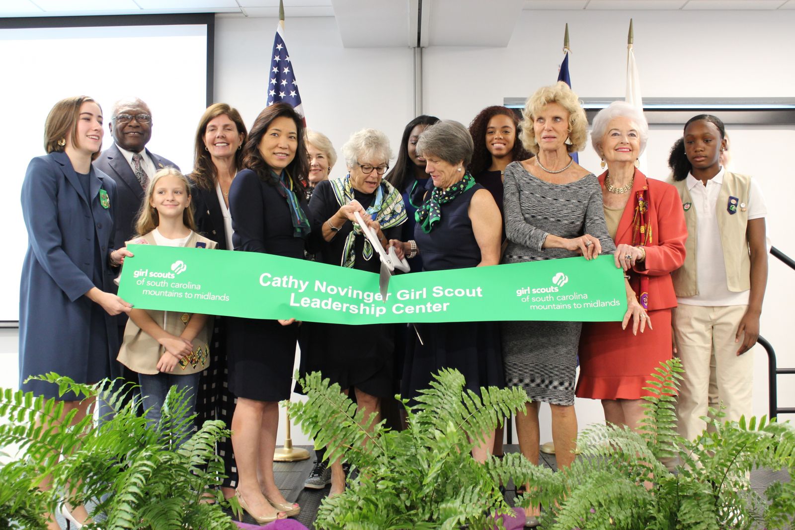 State and community leaders cut the ribbon during the opening of the Cathy Novinger Girl Scout Leadership Center on Saturday. (Photo/Provided)