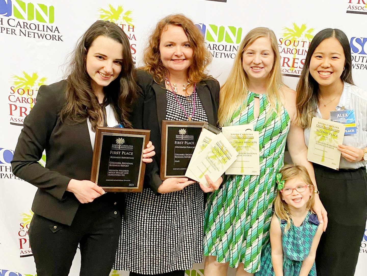 GSA Business Report staff writer Molly Hulsey (from left), Columbia Regional Business Report editor Melinda Waldrop, Charleston Regional Business Journal associate editor Teri Errico Griffis (with daughter Alice) and CRBJ digital editor Alexandria Ng received awards at Friday's SCPA banquet. (Photo/Staff)