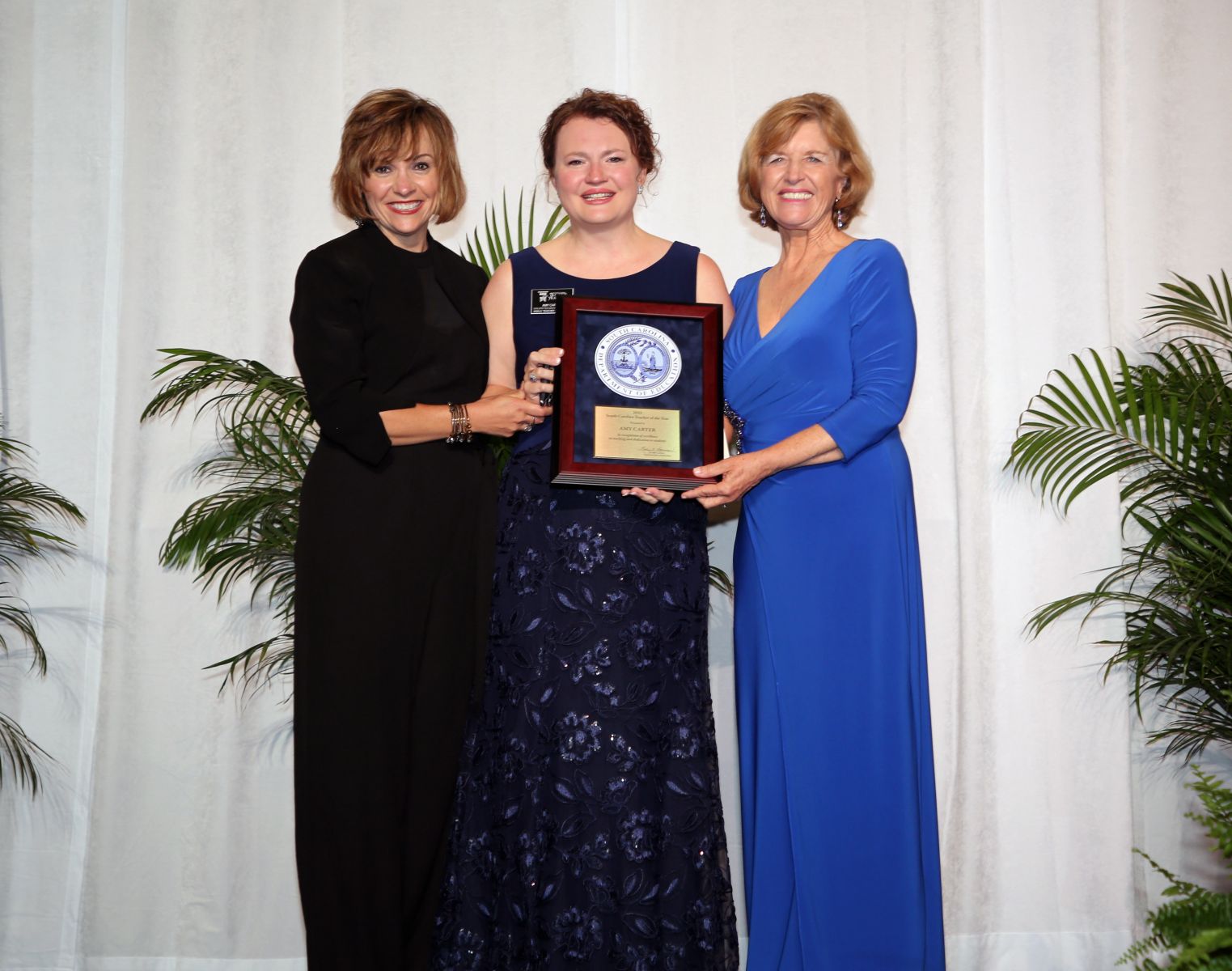 S.C. Superintendent of Education Molly Spearman (right) presented Chapin High School English teacher Amy Carter (center) with the S.C. Teacher of the Year award Wednesday night. (Photo/Provided)
