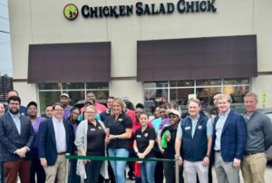 Operators of the Forest Hills Chicken Salad Chick cut the ribbon to open for business as a growing line of customers waited nearby. (Photo/Chicken Salad Chick)